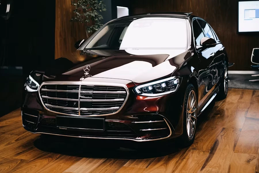 Mercedes-Benz S-Class in a showroom, viewed from the front.