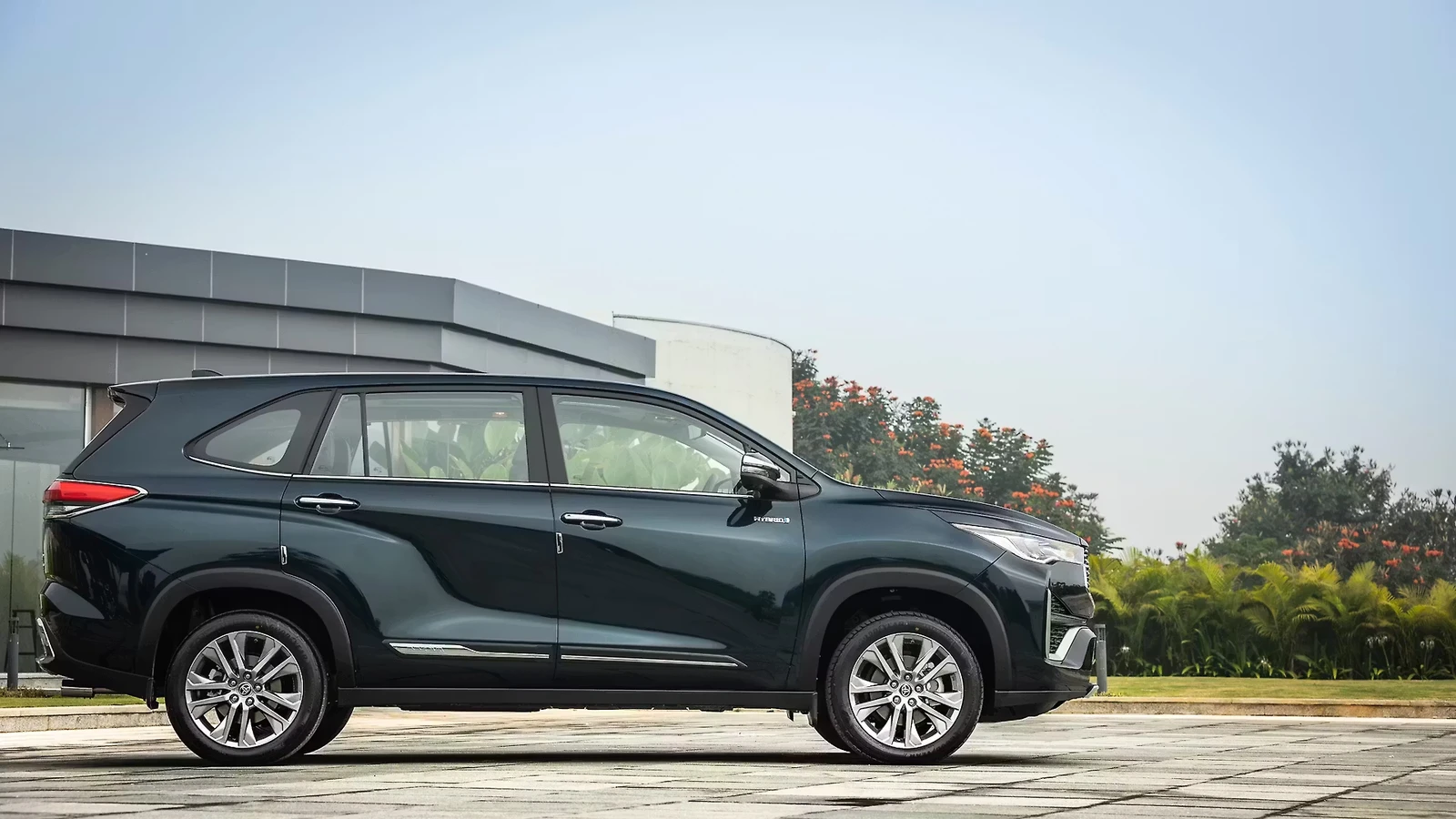 Toyota Innova Hycross in a side profile outdoors.