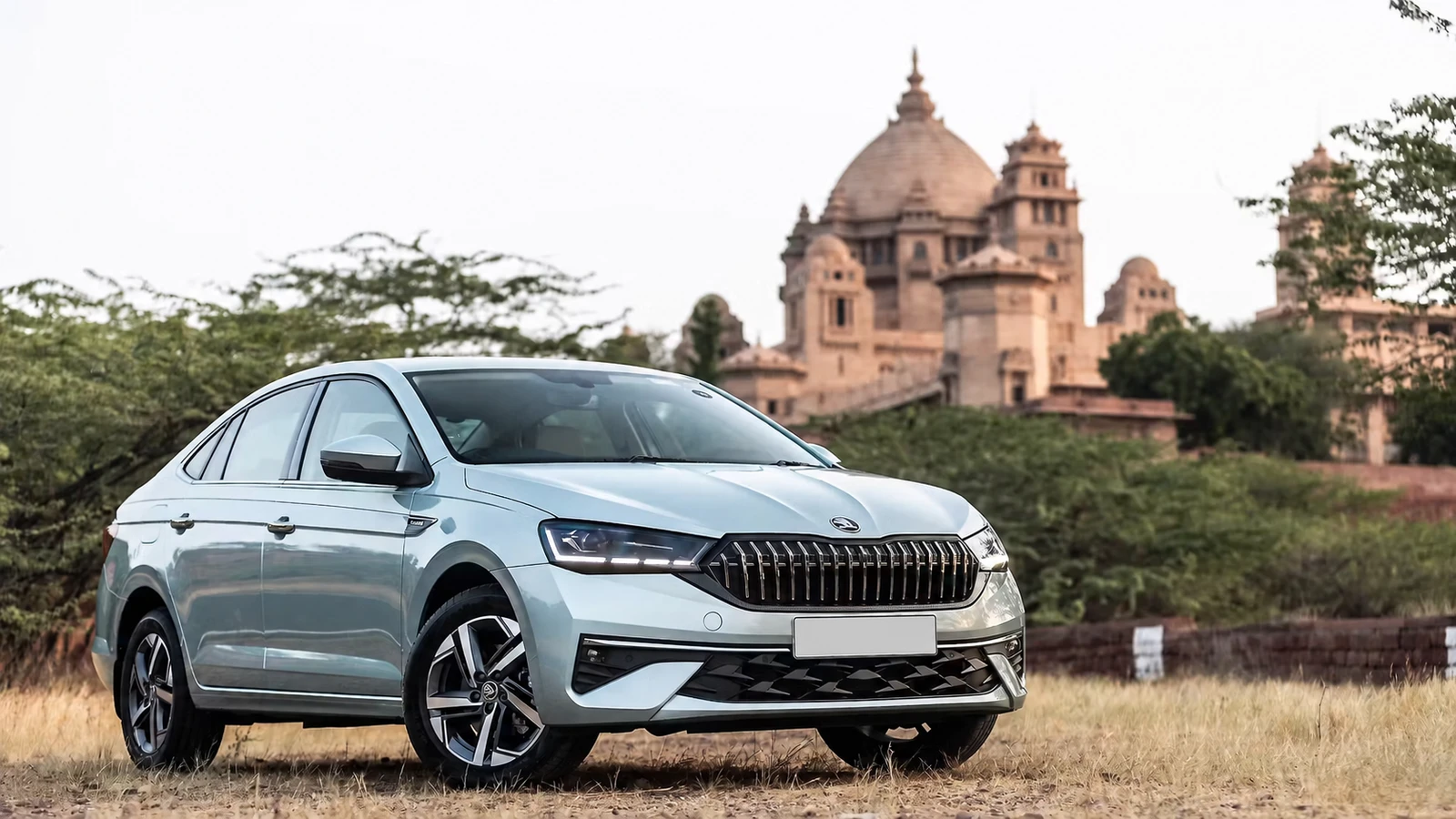 Skoda Slavia with a palace in the background.