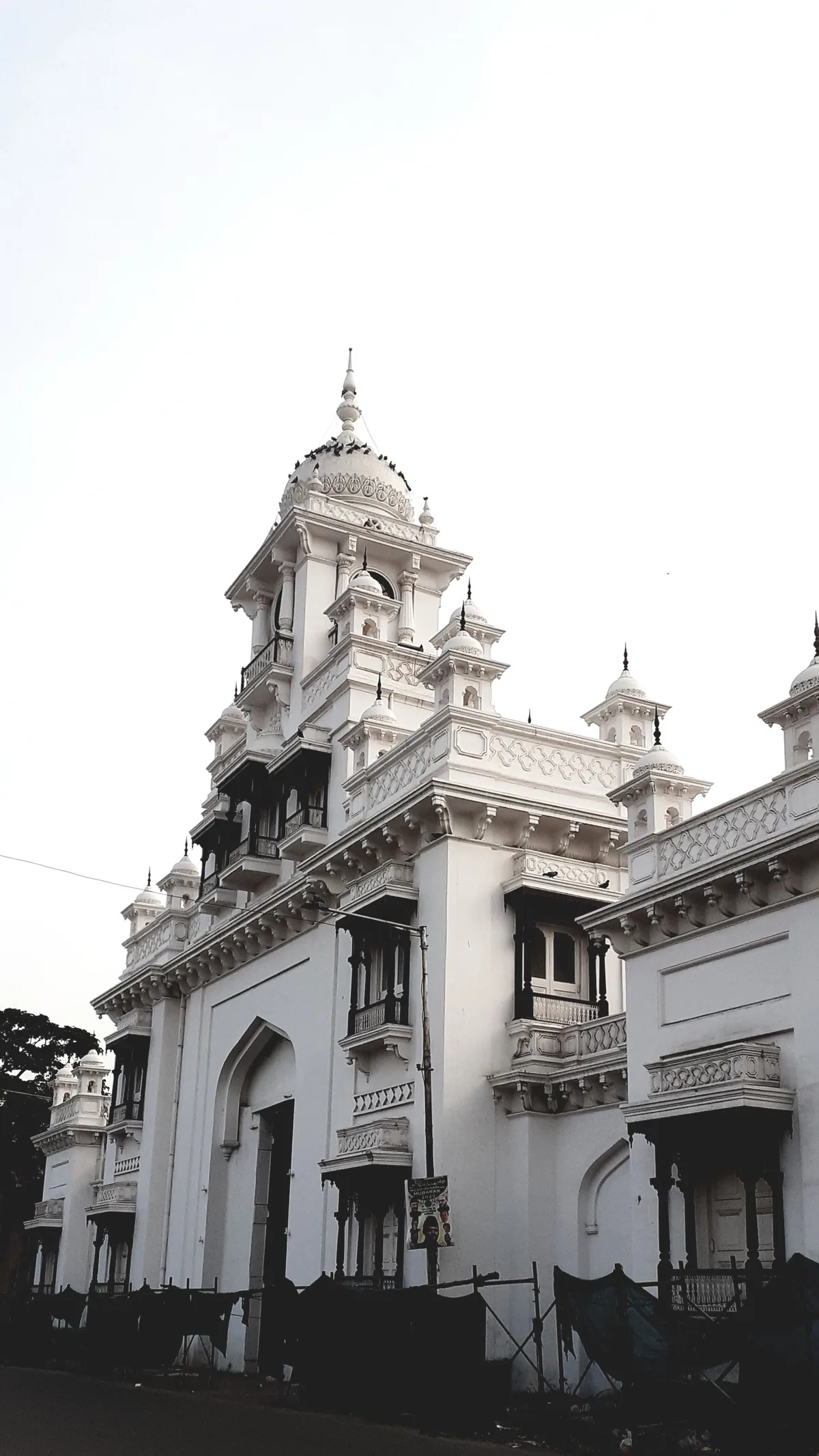 A colonial-era clock tower and civic building in a southern Indian city.