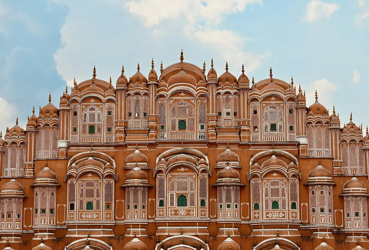 The pink sandstone facade of Hawa Mahal in Jaipur.